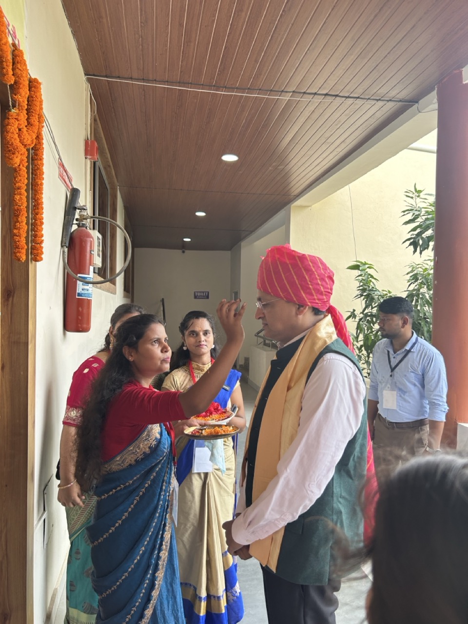 Rajeev Singh receives a traditional welcome with tilak and flowers at Garhwa University during its First Convocation